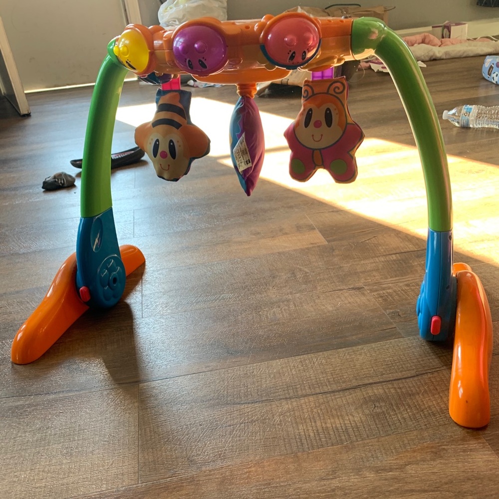 Infant lay under toy